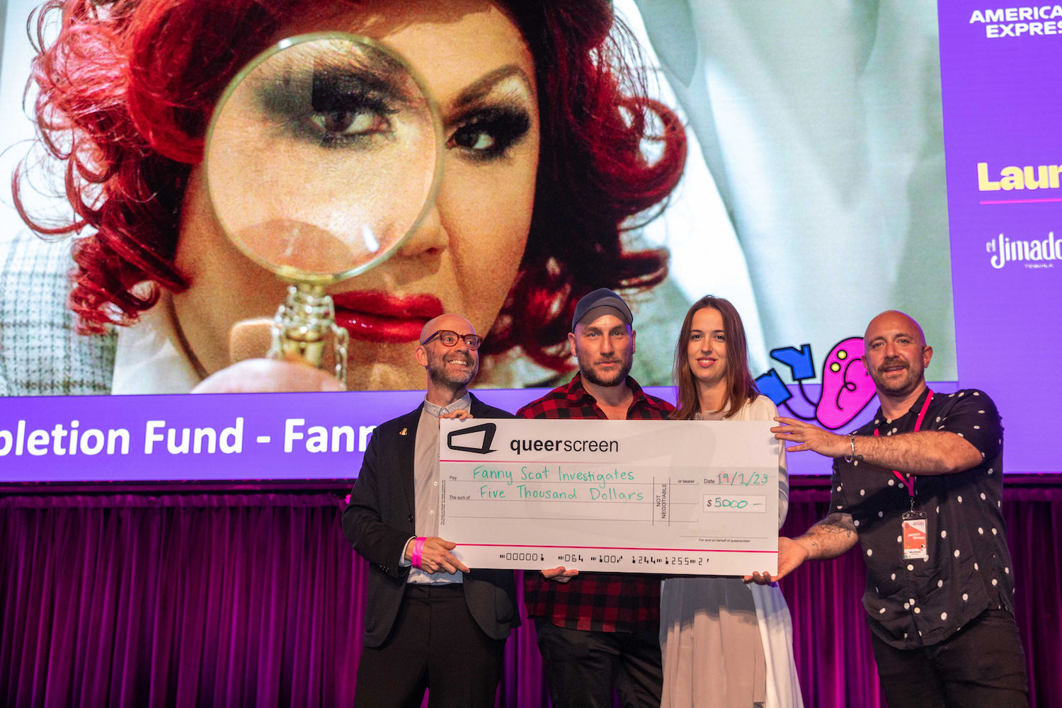 Queer Screen Completion Fund 2023 recipients holding large cheque worth $5,000.