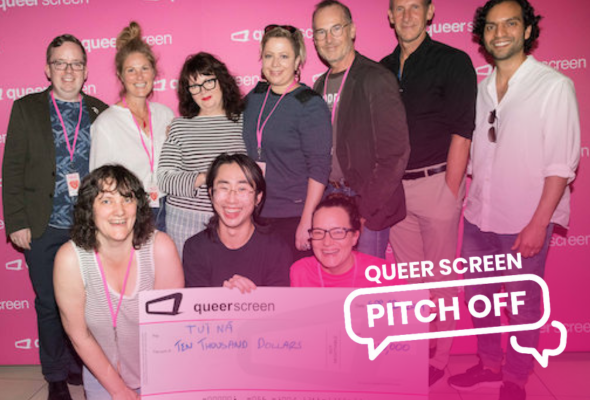 Photo of a group of people holding a large novelty cheque in front of a pink background with the words 'Queer Screen Pitch Off' overlaid.