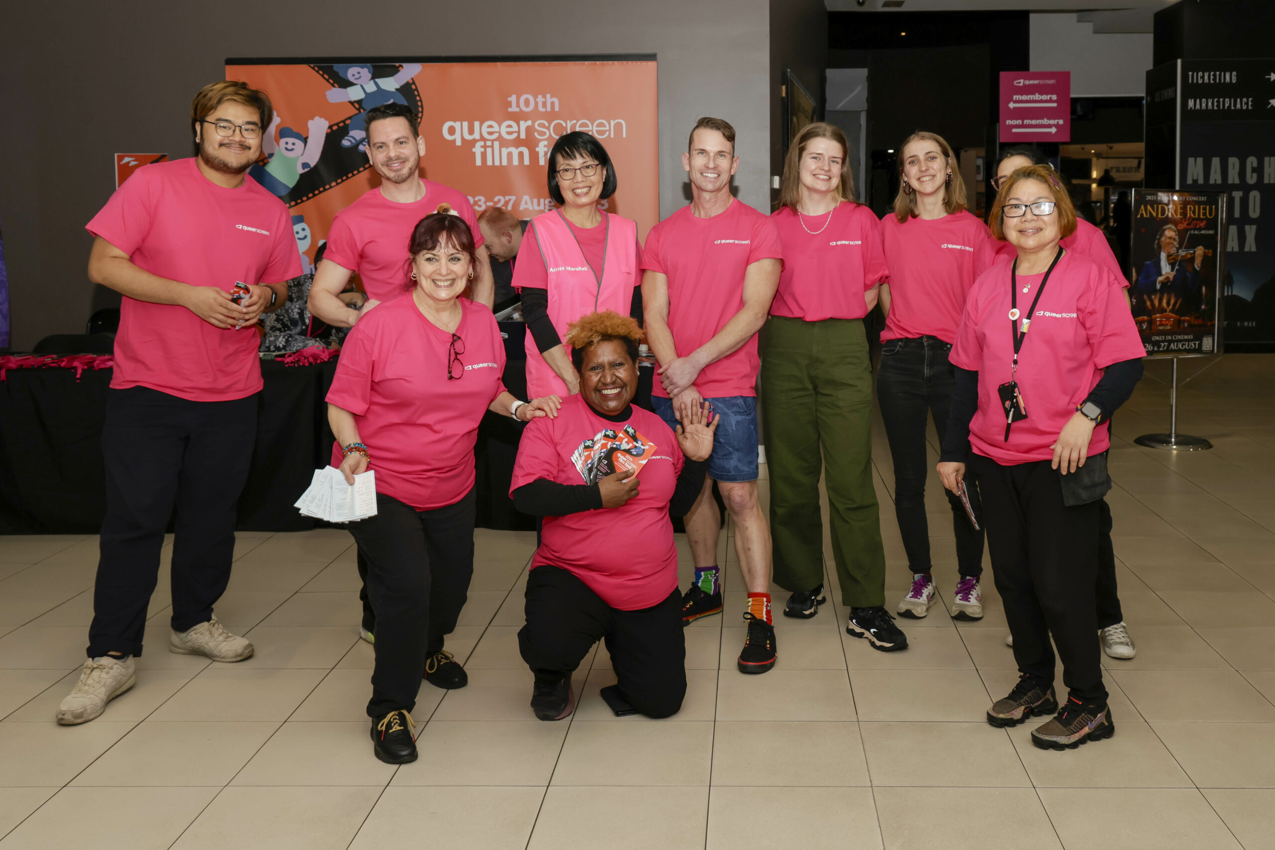 A group of pink shirt volunteers