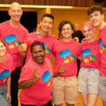 A photograph of Queer Screen volunteers smiling and posing together.